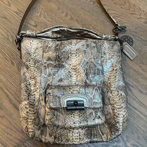 Coach embossed python look bag. In good condition with 2 charms